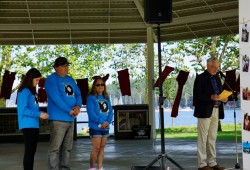 Nanaimo mayor Leonard Krog speaks to the crowd at the 2024 walk for missing Nanaimo woman Lisa Marie Young on June 30 with members of Young's family behind him. 