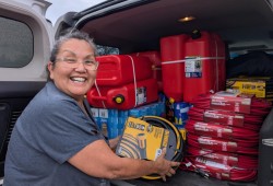 Ditidaht member Margaret Eaton loads supplies into a vehicle to help her community of balaac̓adt deal with a power outage, which lasted from Aug. 11 to 23. Over this period the village relied on generators for electricity. (Judi Thomas photo)