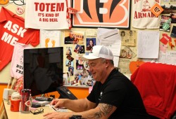 ADSS athletic director Mike Roberts shuffles a deck of Storm branded stickers.