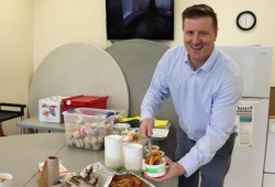 Eighth Avenue Learning principal Nick Seredick serves a hot pasta lunch.