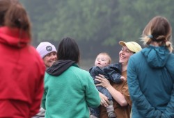 Rachel Leghissa carried baby Mazzy on her back throughout the volunteer clam gardening event.  