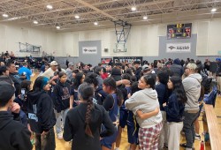 Ahousaht celebrates after the buzzer went on a heartbreaker for Yuułuʔiłʔatḥ.