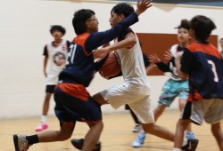 A player with Snaw Naw As dribbles through Ahousaht defenders who were playing on a team coached by Michael Swan. The under-13 game was part of an action-packed tournament with more than its fair share of aggressive play.