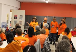 Grace George, left, says a prayer to open up the event alongside Tom Curley, Matthew Curley and Elizabeth George. 