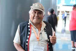 Ehattesaht elder Tom Curley gives a thumbs up at the downtown venue.