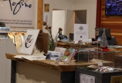 A curation of Indigenous art and jewelry greets visitors as they enter the Tourism Tofino Cox Bay Visitor Centre.