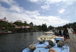Yuquot's dock is located by a Canadian Coast Guard lighthouse.