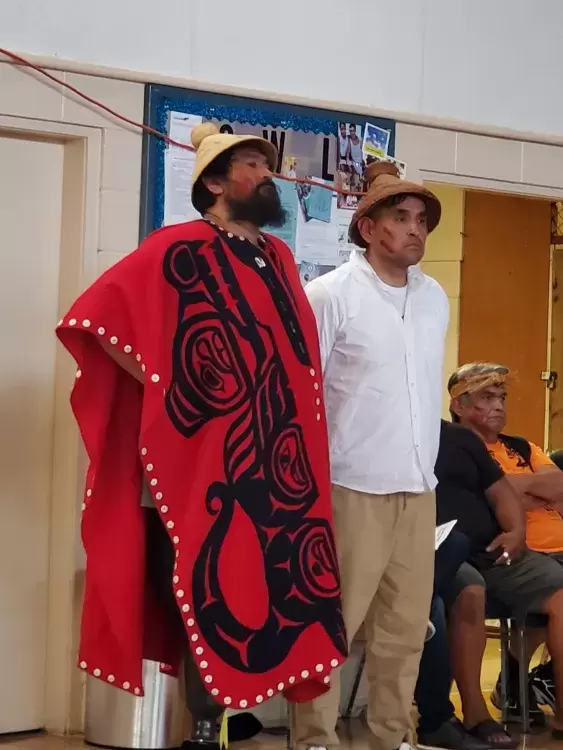 Ahousaht Ha’wiih Hasheukmis (Richard George, standing in for his father Maquinna, Lewis George) and Hanuquii (Nate Charlie) stood before their people at the event.