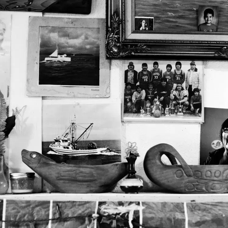 An old polaroid (top left) of the boat that Pat Charleson hand-built hangs on a wall inside his home in Port Alberni. The 90-year-old constructed the 42-foot troller named "Eileen C" in the late-40's without using any power tools, on Jan. 20, 2021.