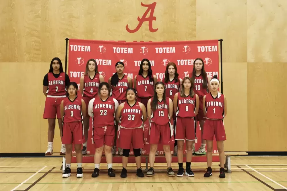 The Alberni District Secondary School's senior girls basketball team poses for a photo within the school's gymnasium, in Port Alberni, on December 9, 2021.