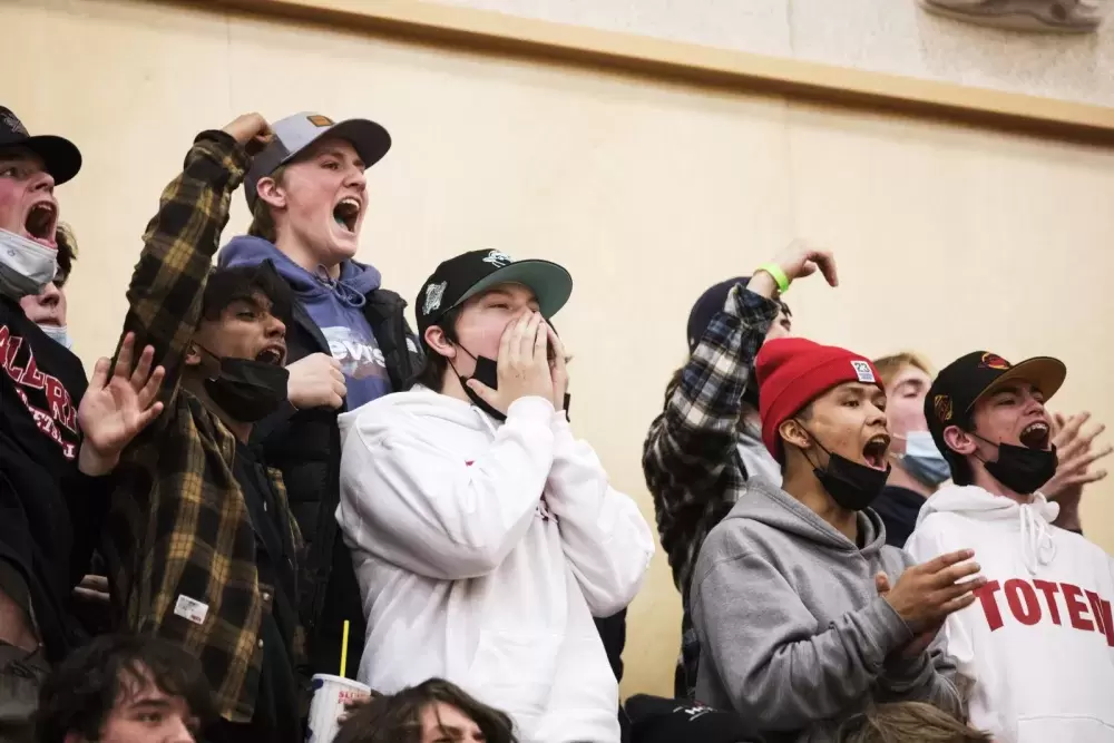 Spectators cheer for the Alberni District Secondary School Armada senior boys' basketball team on first night of the 66th annual Totem Tournament, at ADSS in Port Alberni, on March 10, 2022.