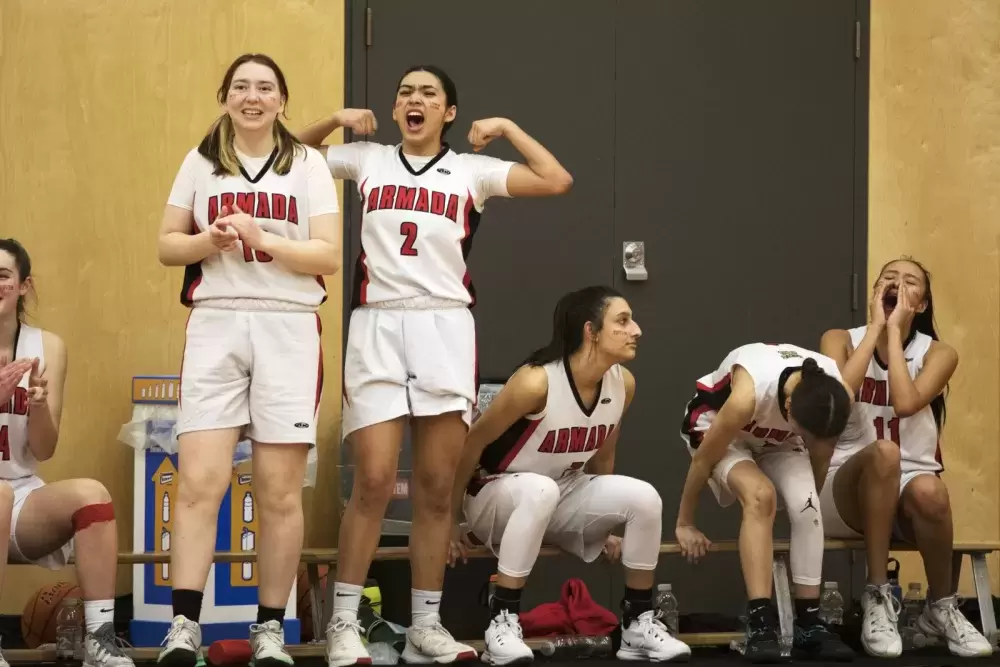 Players on the Alberni District Secondary School Armada senior girls' basketball team react to a play on first night of the 66th annual Totem Tournament, at ADSS in Port Alberni, on March 10, 2022.