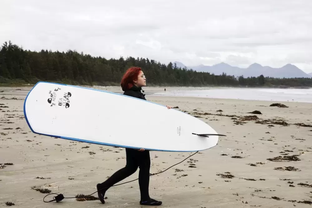 Hannah Frank, 14, walks to the ocean in front of Esowista, near Tofino, on June 14, 2021.