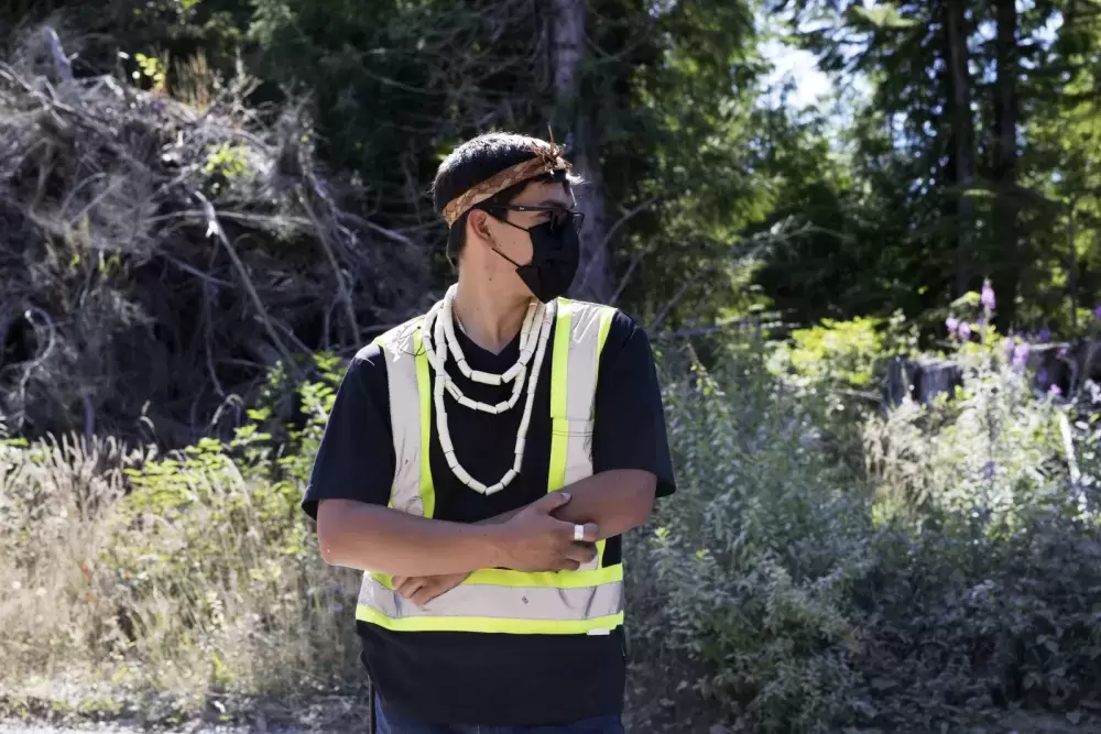 Timmy Masso, a member of the Tla-o-qui-aht First Nation, organized a road closure on West Main Forest Service Road to block tourists from accessing the road, near Tofino, on August 10, 2021. 