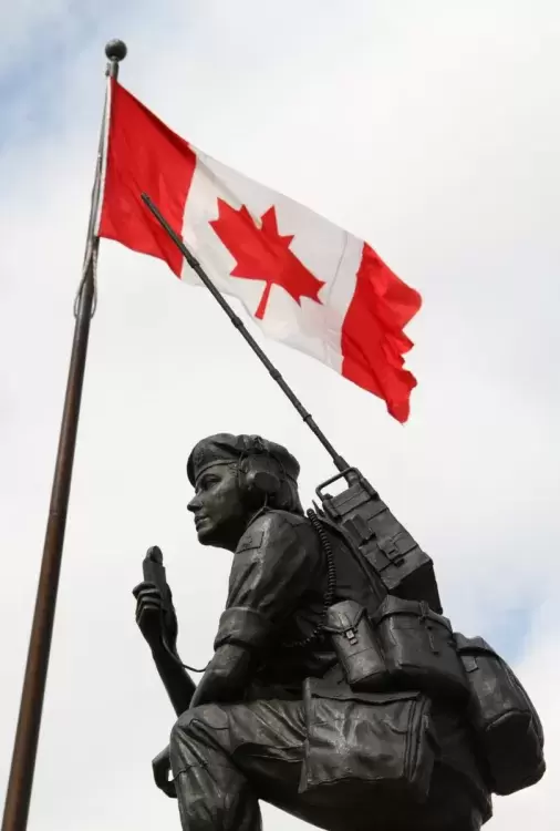 The Canadian flag flies over the Peacekeeping Memorial in Ottawa. (Ken Banks/Wikimedia Commons photo)