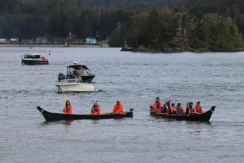 Residential School warriors paddle from Kakawis or the old Christie Residential School to Tofino’s First Street Dock.