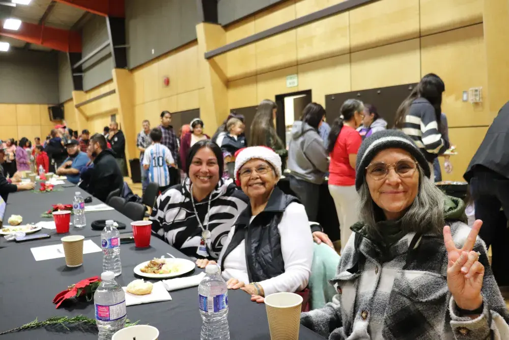 Ehattesaht/Chinehkint First Nation director Thlaqua (Georgina Amos), centre, is all smiles with granddaughter Lisa Smith, left, and Victoria Wells.