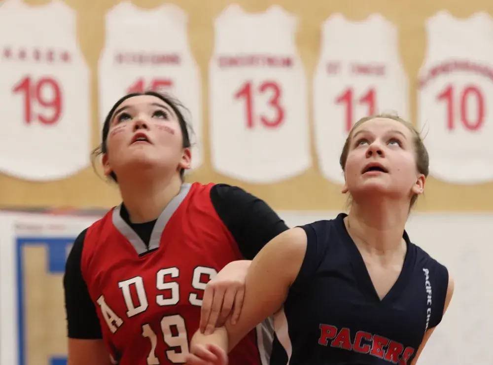 Alberni player Hayleigh Watts, left, watches the ball at the Totem finals in January 2024. (Alexandra Mehl photo) 