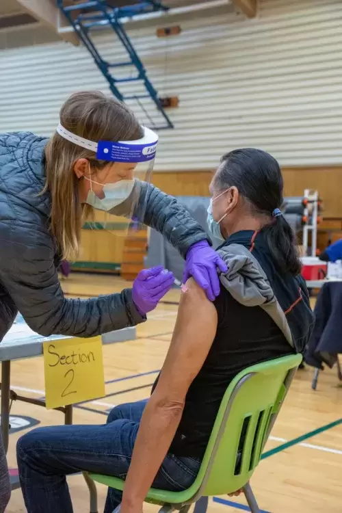 Ahousaht Chief Councillor Greg Louie receives the Moderna vaccine on Jan. 6, part of widespread distribution in the community. (Courtenay Louie photo) 