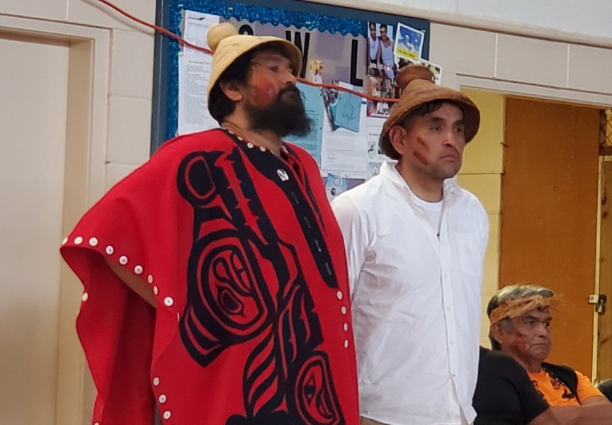 Ahousaht Ha’wiih Hasheukmis (Richard George, standing in for his father Maquinna, Lewis George) and Hanuquii (Nate Charlie) stood before their people at the event.