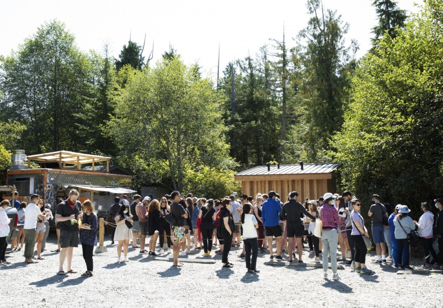 A line-up gathers outside Tacofino food truck at lunchtime, in Tofino, on August 24.