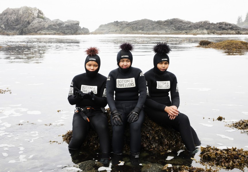 (From left to right) Kenneth Lucas, Brandi Lucas and Jaidin Knighton pose for a photo with sea urchins after snorkelling along the Wild Pacific Trail, in Ucluelet, on August 18, 2021.