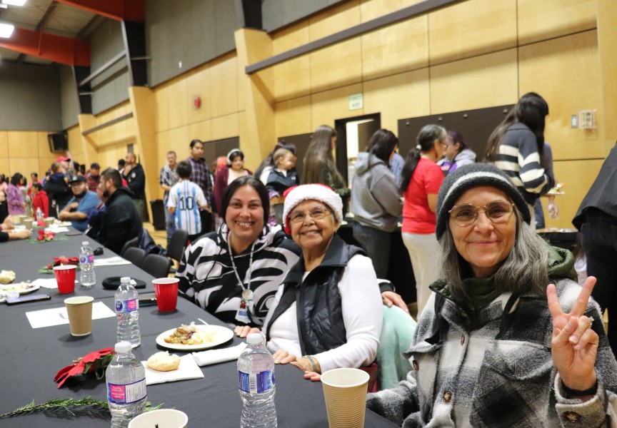 Ehattesaht/Chinehkint First Nation director Thlaqua (Georgina Amos), centre, is all smiles with granddaughter Lisa Smith, left, and Victoria Wells.