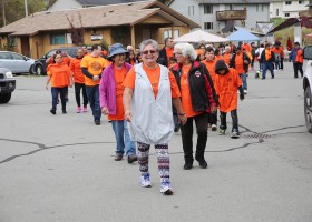 Deb Cook leads the way for a walk for Orange Shirt Day