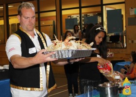 Former principal Dave Maher helps serve up the luncheon