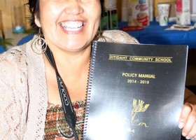 Margaret Eaton, a member of the Ditidaht Education Authority, displays the new policy manual.