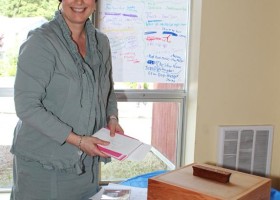 Principal Sheila McKee displays the cards that were put in the time capsule