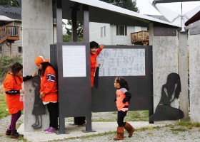 Nuu-chah-nulth children play around the Strength from Within monument