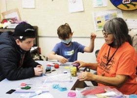 Grace George helps Grade 3-4 students with their art projects at the Wickaninnish Community School, in Tofino, on November 22, 2021.